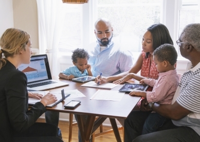 Multi-Generational Family at Table with Advisor